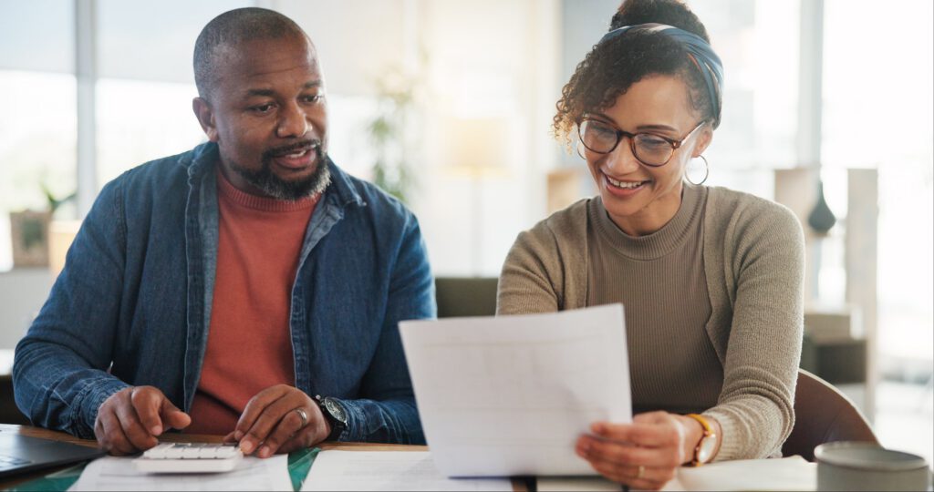 Couple reviewing behavioral health treatment plan and paperwork together