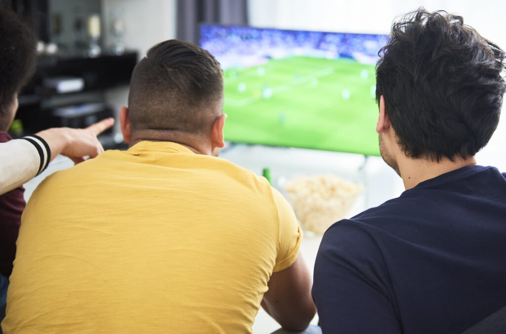 Men in a recovery house spending time together and building brotherhood in a sober living community