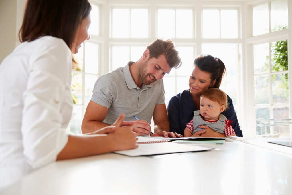 Care coordinator meets with parents and their baby to discuss family support services
