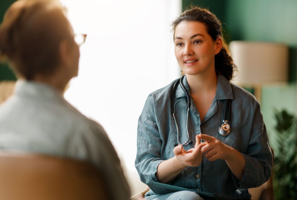 Healthcare provider discussing treatment plan with patient during mental health consultation