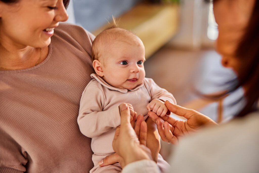 Support worker meeting with a mother and infant to provide guidance during maternal recovery